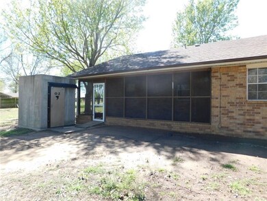 Back of house has screened in porch and the OZ abo