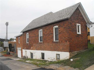 Exterior Front. Alternate view of main access in a