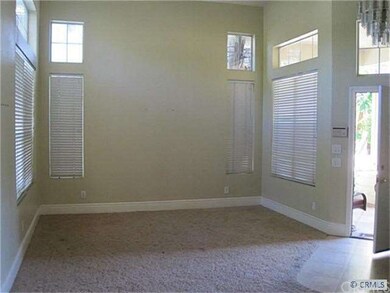 open light and bright living room with vaulted cei