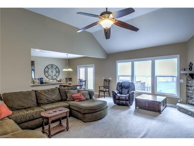 vaulted living room with view of the course