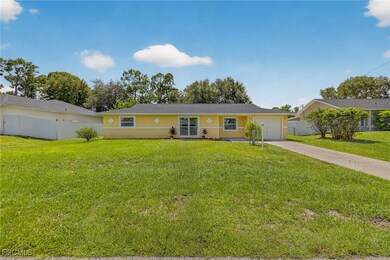 Ranch-style house with driveway, stucco siding, and a garage