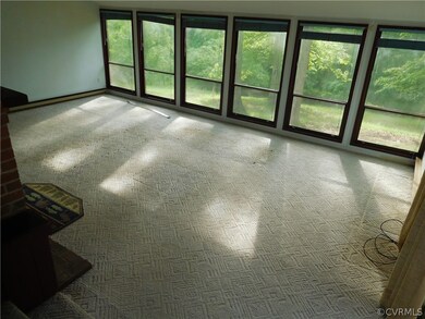 Family room with vaulted ceiling and brick firepla