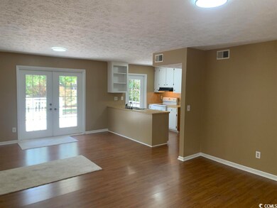 Dining area with French door to back deck.