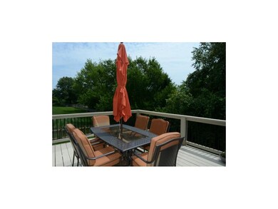 Deck off kitchen with mature trees!