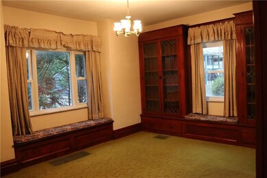 Dining room showing built in and window seats.
