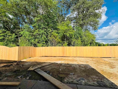 View of fenced backyard