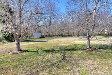Huge, level, private,  fenced back yard, backs up 