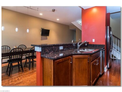 Upgraded Kitchen with Granite Counters, Breakfast Bar, Hardwood Floors and All Stainless Steel               Appliances