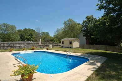 WOW!  Your backyard is complete with an amazing in-ground pool, deck, patio, privacy fence and grassy area!