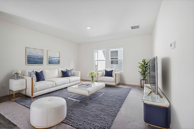 Living area featuring baseboards