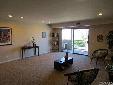 Living Room has Balcony with a View of the City!
