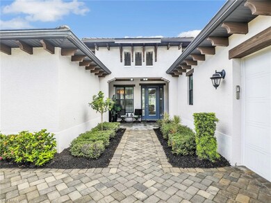 View of exterior entry featuring stucco siding
