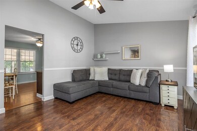 Living room w/ vaulted ceilings