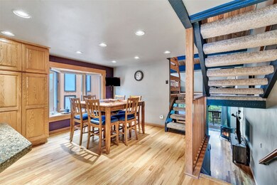 Kitchen and bar seating with sightlines into the d
