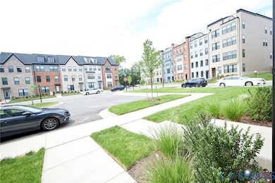 View of asphalt street with traffic signs and sidewalks