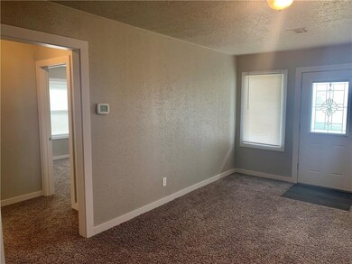 View of living room and into guest bedrooms and ba