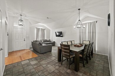 Dining space featuring dark wood-type flooring, a 