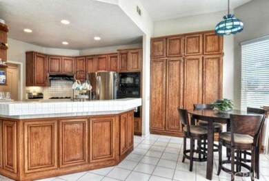 The kitchen is spacious with a separate nook...