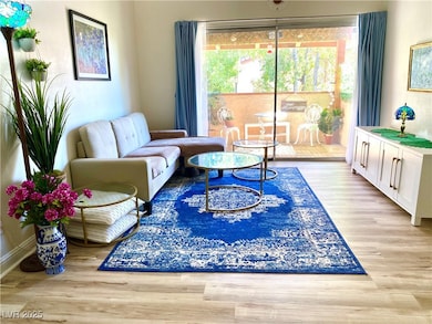 Living area with light wood-style floors