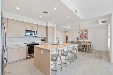 Kitchen featuring a breakfast bar, sink, a center