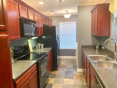 Lots of cabinets and counter space. Plant window o
