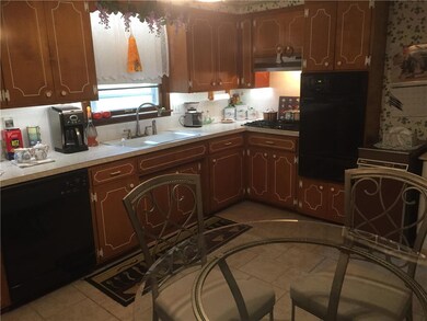 LOTS OF CABINETS, NEWER BUILT IN DISHWASHER, COOK 