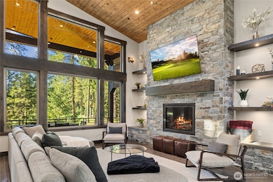 Great room anchored by a stunning stone fireplace.