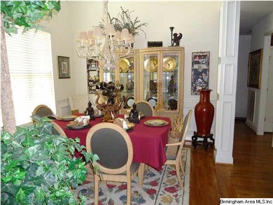Open dinning with columns.  Beautiful hardwoods an