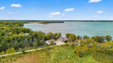 From the moment you arrive, the setting and design will impress, with thoughtful details and an open-concept layout that frames the beauty of the lake.