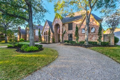Amazing curb appeal with mature trees and circle d