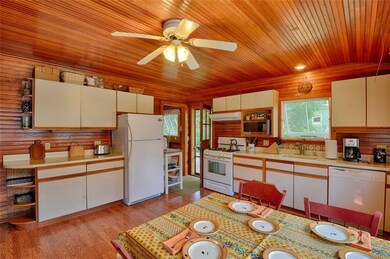A generous kitchen with horizontal southern fir wa