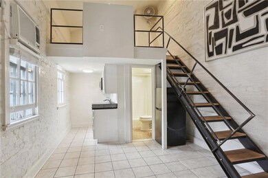 Loft bedroom above the updated kitchen and bath.  Windows keep the condo filled with sunlight.