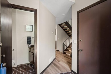 1/2 bath on main level and split staircase leading up to upper level.