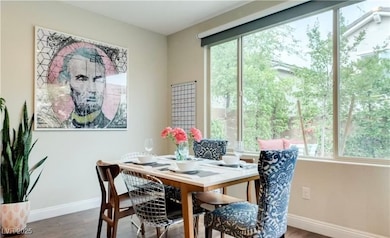 Dining room featuring baseboards and wood finished