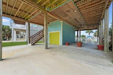 Enjoy the convenience of ample covered space beneath the home—ideal for parking, entertaining, or setting up an outdoor lounge to savor breezy island afternoons.