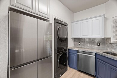 Kitchen with light wood-style floors, blue cabine