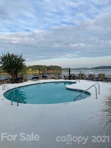 Relax in the pool and watch the boats out on Lake Norman.