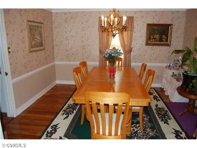 Dining Room - Dining room: hardwood floor, crown molding, chair rail and chandelier