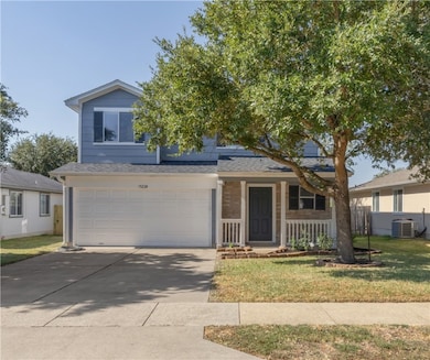 View of front of home featuring concrete driveway,