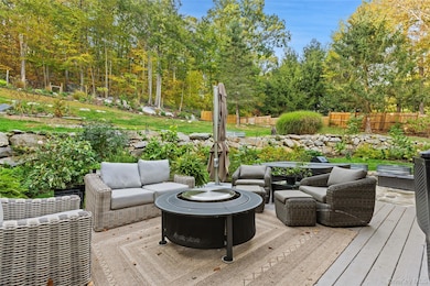Patio featuring a fire pit and hot tub