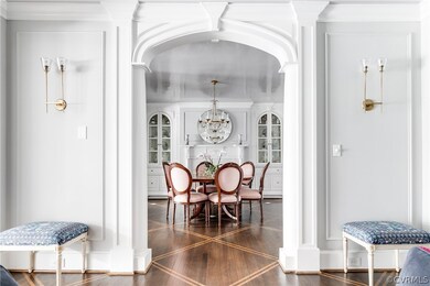 Formal Dining Room through custom arched millwork