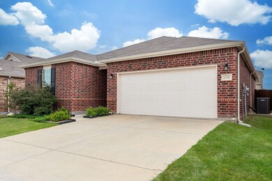 Ranch-style house with a garage, a front lawn, and