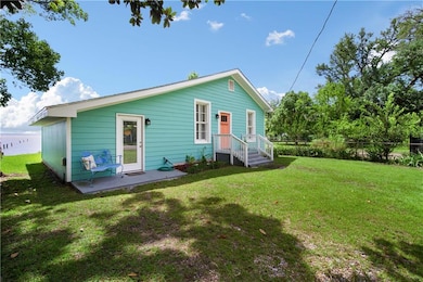 Rear view of property featuring a water view and a