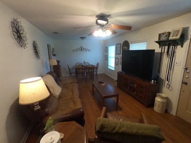 Living room featuring wood finished floors and a c