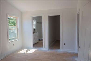 Master bedroom view of bathroom and walk-in closet