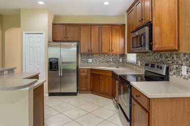 Wooden cabinets with cultured marble and stainless