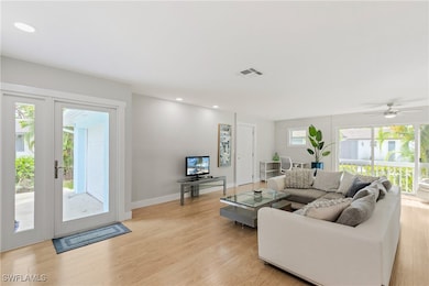Living room featuring light wood-type flooring, ce