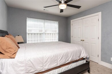 1 of 3 guest bedrooms with double door closet and