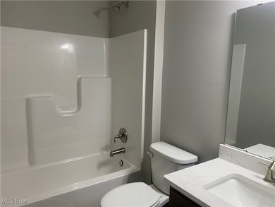 Bathroom with vanity and  shower combination