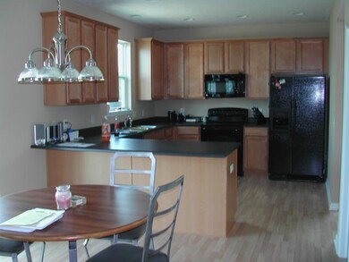 Kitchen. WONDERFULLY LARGE KITCHEN WITH BREAKFAST BAR, WALK IN PANTRY, BREAKFAST ROOM, LAMINATE FLOORING!
